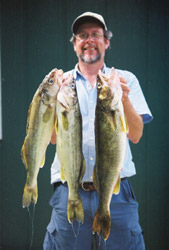 Al with 3 nice walleye - the big one on the right was 6.8lbs